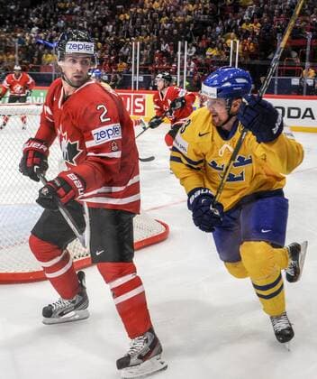 Stockholm 2013 05 16 Ice-Hockey World Championship 2013 - Canada CAN vs Sweden SWE - Pictures shows Dan Hamhuis CAN 2 and Henrik Sedin SWE 33 KPkod 08002 