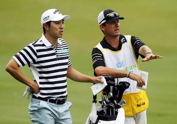 16 MAY 2013: Sang-Moon Bae and his caddie on the 18th fairway during the first round of the HP Byron Nelson Championship played at TPC Las Colinas Four Season Resort in Irving, TX. GOLF: MAY 16 PGA Golf Herren - HP Byron Nelson Championship - First Round Icon1305160641 EDITORIAL USE ONLY