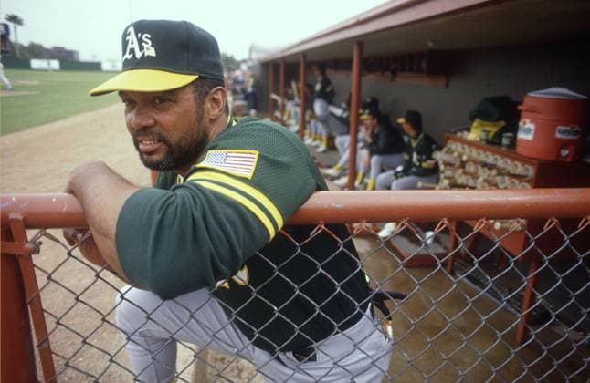 Phoenix, ARIZONA, US - PHOENIX, ARIZONA, USA : Reggie Jackson, special assignment coach for the Oakland A s, watches a cactus league game against the Seattle Mariners during Spring Training in Phoenix, Arizona on 13 March, 1991. PHOENIX, ARIZONA MLB  - ZUMAm11