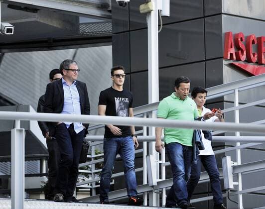 Mesut Ozil - player of Real Madrid and Germany- coming out with his father Mustafa and another agent from Real Madrid offices in Santiago Bernabeu in Madrid, Spain, 23 05 2013. © Francesca CeciariniÖ NJF Media 
