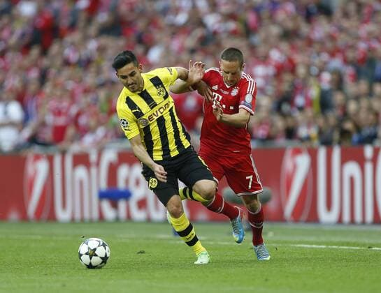 Dortmund s Ilkay Gundogan tussles with Munich s Franck Ribery - Borussia Dortmund vs Bayern Munich - UEFA Champions League Final - Wembley Stadium - London - England -25 05 2013 - EDITORIAL USE ONLY. No use with unauthorised audio, video, data, fixture lists, club league logos or live services. Online in-match use limited to 120 images, no video emulation. No use in betting, games or single club league player publications.