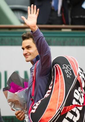 (130526) -- PARIS, May 26, 2013 (Xinhua) -- Roger Federer of Switzerland greetings to crowds after winning his men s singles first round match against during the 2013 French Open tennis tournament at Roland Garros in Paris, France, on May 26, 2013. (Xinhua Bai Xue) (jyc) (SP)FRANCE-PARIS-TENNIS-FRENCH OPEN-FEDERER 