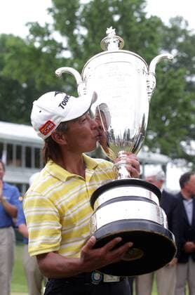 Kohki Idoki of Japan kisses the Bourne Trophy after winning the 74th Senior PGA Golf Herren Championship at Bellerive Country Club in St. Louis on May 26, 2013. Idoki won the tournament with an 11 under.  SLP2013052609