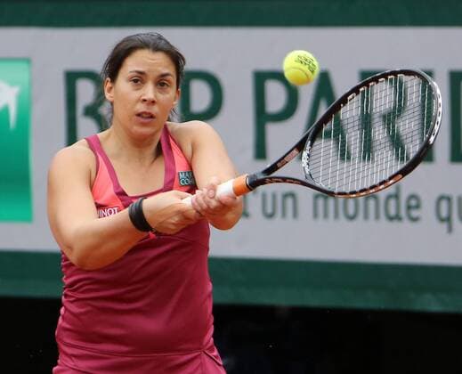 Marion Bartoli of France hits a shot during her French Open women s first round match at Roland Garros in Paris on May 28, 2013.  PAR20130528724