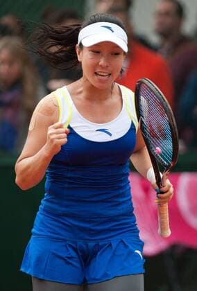 Zheng Jie of China celebrates during her women s singles second round match on day 5 of the 2013 French Open tennis tournament at Roland Garros in Paris, France on May 30, 2013. (Xinhua Bai Xue) (SP)FRANCE-PARIS-TENNIS-FRENCH OPEN 