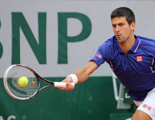 Serbian Novak Djokovic hits a shot during his French Open men s second round match at Roland Garros in Paris on May 30, 2013.  PAR20130530704
