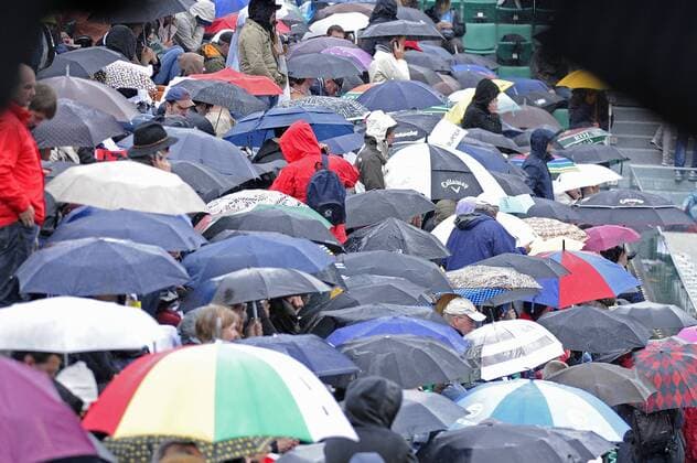 30.05.2013 Paris, France. The fans put up their umbrellas to shelter from the rain during the match between Novak Djokovic of Serbia and Guido Pella of Argentina in the second round of the French Open from Roland Garros. xDavidxEmmx  ActionPlus20253373