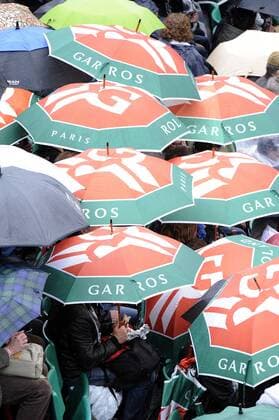 30.05.2013 Paris, France. The fans put up their umbrellas to shelter from the rain during the match between Novak Djokovic of Serbia and Guido Pella of Argentina in the second round of the French Open from Roland Garros. xDavidxEmmx  ActionPlus20253386