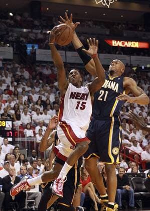 May 30, 2013 - Miami, FL, USA - The Miami Heat s Mario Chalmers (15) charges past the Indiana Pacers David West for a first quarter basket in Game 5 of the Eastern Conference finals on,Thursday, May 30, 2013, at AmericanAirlines Arena in Miami, Florida. Game 5: Indiana at Miami - ZUMAm67