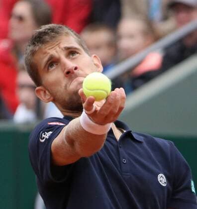 Martin Klizan of Slovakia hits a serve during his French Open men s second round match at Roland Garros in Paris on May 31, 2013.  PAR20130531709
