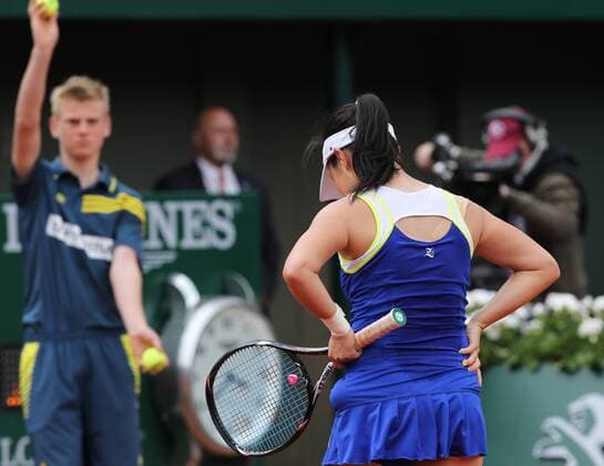 (130601) -- PARIS, June 1, 2013 (Xinhua) -- Zheng Jie of China reacts during women s singles third round match at the French Open tennis tournament at the Roland Garros stadium in Paris, France, June 1, 2013. 