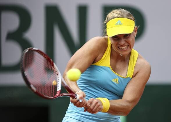 (130602) -- PARIS, June 2, 2013 (Xinhua) -- Angelique Kerber of Germany hits a return during the women s singles fourth round match on day 8 of the 2013 French Open tennis tournament at Roland Garros in Paris, France, on June 2, 2013. (Xinhua Tang Shi) (jyc) (SP)FRANCE-PARIS-TENNIS-FRENCH OPEN 