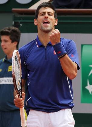 (130603) -- PARIS, June 3, 2013 (Xinhua) -- Serbia s Novak Djokovic celebrates after winning during the men s singles fourth round match at the French Open tennis tournament in Paris, France, on June 3, 2013. (Xinhua Gao Jing) (SP)FRANCE-PARIS-TENNIS-FRENCH OPEN-MS- 