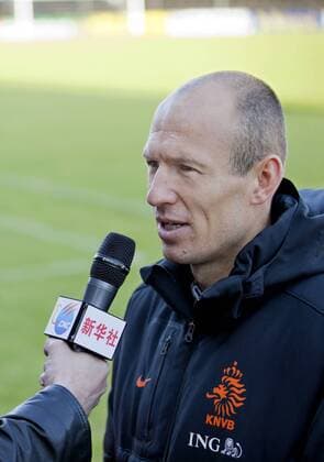 (130604) -- KATWIJK, 2013 (Xinhua) -- Dutch national football player Arjen Robben is interviewed after the final training session before their trip to Asia in Katwijk, the Netherlands, on June 3, 2013. The Netherlands will play against Indonesia on June 7 and China on June 11. (Xinhua Rick Nederstigt) (SP)NETHERLANDS-KATWIJK-SOCCER-TRAINING 