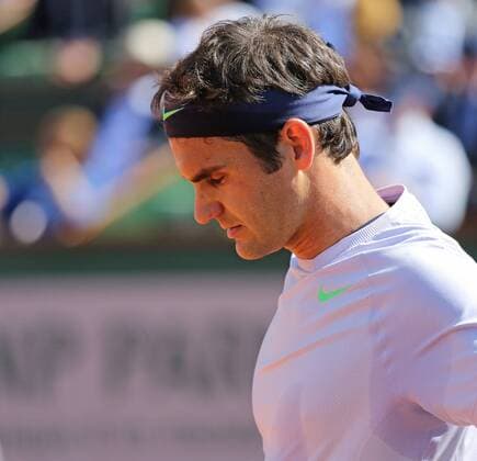 Roger Federer of Switzerland pauses at Roland Garros in Paris on June 4, 2013.  PAR20130604704