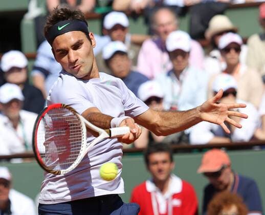 Roger Federer of Switzerland hits a shot at Roland Garros in Paris on June 4, 2013.  PAR20130604705