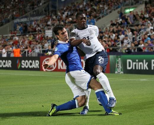 England s Marvin Sordell tussles with Italy s Gulio Donati - England U21 vs Italy U21 - UEFA U21 Championship 2013 - Bloomfield Stadium - Tel Aviv - 05 06 2013 - EDITORIAL USE ONLY. No use with unauthorised audio, video, data, fixture lists, club league logos or live services. Online in-match use limited to 120 images, no video emulation. No use in betting, games or single club league player publications.