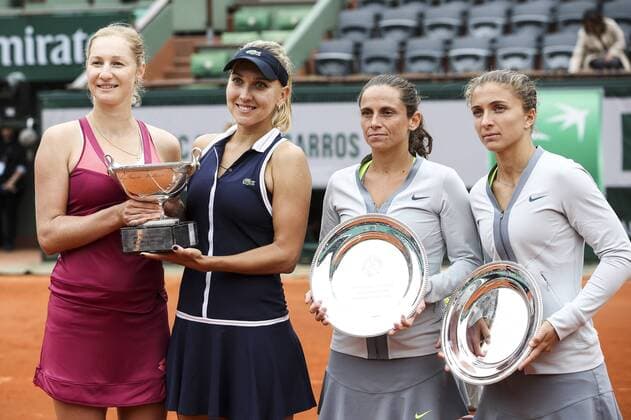 (130609) -- PARIS, June 9, 2013 (Xinhua) -- Russia s Ekaterina Makarova (1st,L) and Elena Vesnina (2nd L), Italy s Sara Errani (1st,R) and Roberta Vinci pose with their trophies after their women s doubles final match at the French Open tennis tournament in Paris June 9, 2013. Ekaterina Makarova and Elena Vesnina won 2-0 to claim the title. (Xinhua Tang Shi) (SP) FRANCE-PARIS-TENNIS-WOMEN S DOUBLES FINAL 