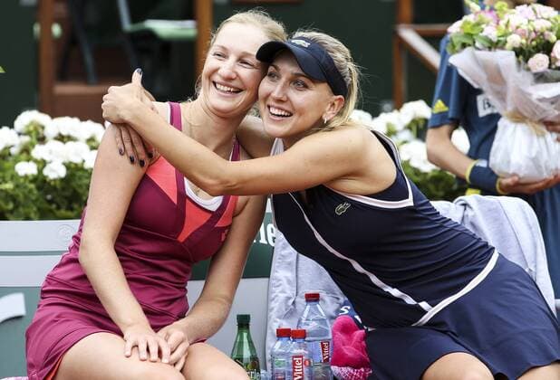 (130609) -- PARIS, June 9, 2013 (Xinhua) -- Ekaterina Makarova and Elena Vesnina (R) of Russia celebrate after winning the women s doubles final match against Sara Errani and Roberta Vinci of Italy at the French Open tennis tournament in Paris June 9, 2013. Ekaterina Makarova and Elena Vesnina won 2-0 to claim the title. (Xinhua Tang Shi) (SP) FRANCE-PARIS-TENNIS-WOMEN S DOUBLES FINAL 