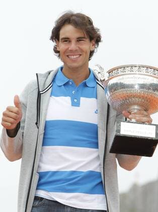 PARIS, June 10, 2013 -- Spain s Rafael Nadal poses with the trophy at the Disneyland in Paris June 10, 2013. 
