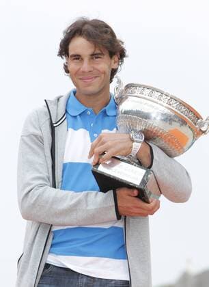 PARIS, June 10, 2013 -- Spain s Rafael Nadal poses with the trophy at the Disneyland in Paris June 10, 2013. 