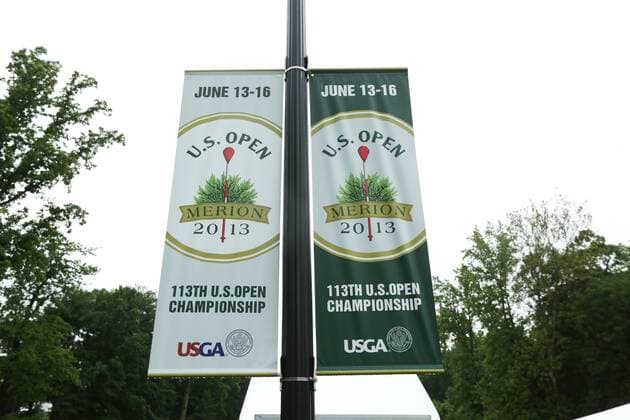 June 10 2013: Banners of the 113th US Open Championship hang in the rain on a light post during monday s practice round at the 2013 U.S. Open hosted by Merion Golf Club in Ardmore, PA. GOLF: JUN 10 PGA Golf Herren - U.S. Open - Monday Practice Round Icon131830 EDITORIAL USE ONLY