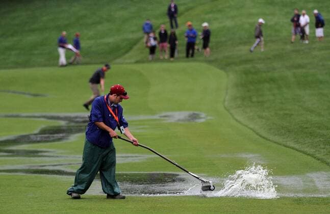 June 10, 2013 - Ardmore, PA, USA - Crew members try to dry the 16th fairway during a practice round for the U.S. Open on Monday, June 10, 2013, At Meriod Golf Club in Ardmore, Pennsylvania. U.S. OPEN PRACTICE ROUNDS - ZUMAm67