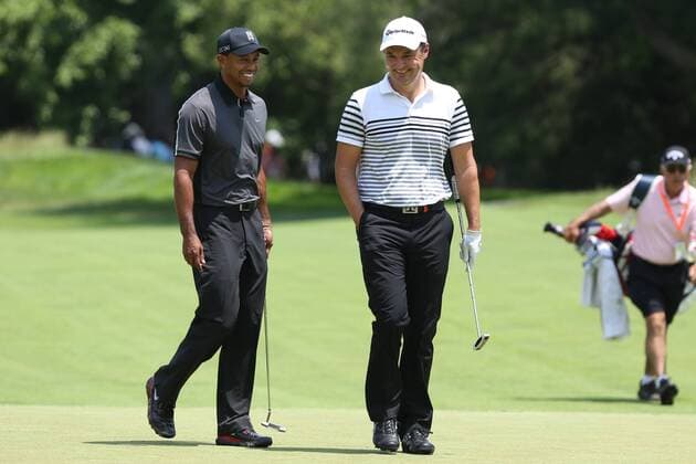 June 11 2013: Tiger Woods and Simon Khan share a lighter moment as the talk while walking to the 1st green during tuesday s practice round at the 2013 U.S. Open hosted by Merion Golf Club in Ardmore, PA. GOLF: JUN 11 PGA Golf Herren - U.S. Open - Tuesday Practice Round Icon20325939 EDITORIAL USE ONLY