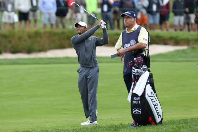 June 14 2013: Tiger Woods hits in front of his old Caddie Steve Williams during the resumption of the first round on day 2 at the 2013 U.S. Open hosted by Merion Golf Club in Ardmore, PA. GOLF: JUN 14 PGA Golf Herren - U.S. Open - First Round Icon132447 EDITORIAL USE ONLY