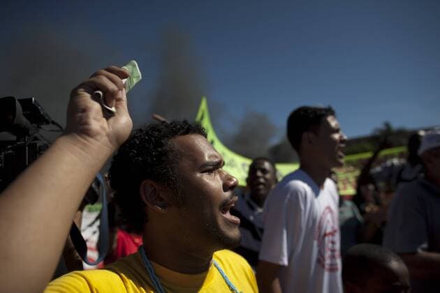 A man attends a protest in front of the Mane Garrincha National Stadium, in Brasilia, Brazil, on June 14, 2013. (Xinhua Guillermo Arias) (py) (SP)BRAZIL-BRASILIA-CONFEDERATIONS-PROTEST 