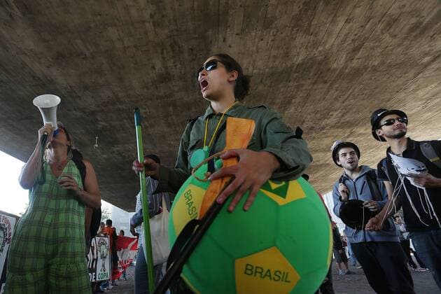 Demonstrators protest against millionaire public spending for the FIFA Confederations Cup Brazil 2013 and the World Cup Brazil 2014, in Sao Paulo, Brazil, on June 14, 2013. (Xinhua Rahel Patrasso) (itm) (sp) (SP)BRAZIL-SAO PAULO-CONFEDERATIONS-PROTEST 