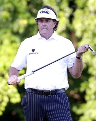 Phil Mickelson reacts after missing a putt for birdie on the on the 12th hole in the second round at the 113th USA Open at Merion Golf Club in Ardmore, Pennsylvania on June 14, 2013.  PHI20130614136