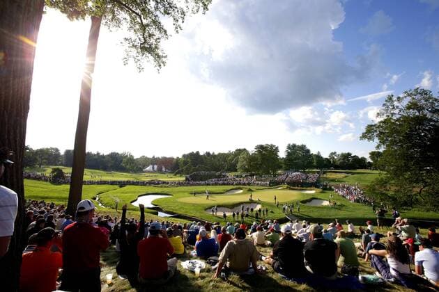 Fans watch Phil Mickelson putt on the 9th green in the second round at the 113th USA Open at Merion Golf Club in Ardmore, Pennsylvania on June 14, 2013.  PHI20130614133
