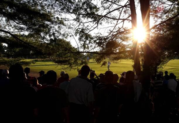 Fans watch Shawn Stefani hits to the 18th green in the second round at the 113th USA Open at Merion Golf Club in Ardmore, Pennsylvania on June 14, 2013.  PHI20130614140