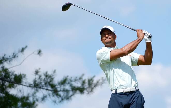 Tiger Woods hits a tee shot on the 4th hole in the third round at the 113th U.S. Open at Merion Golf Club in Ardmore, Pennsylvania on June 15, 2013.  PHI20130615105