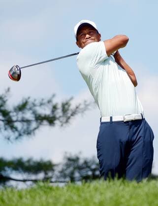 Tiger Woods hits a tee shot on the 4th hole in the third round at the 113th U.S. Open at Merion Golf Club in Ardmore, Pennsylvania on June 15, 2013.  PHI20130615106