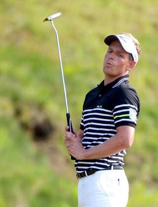Luke Donald reacts after missing a putt for birdie on the ninth hole in the third round at the 113th U.S. Open at Merion Golf Club in Ardmore, Pennsylvania on June 15, 2013.  PHI20130615118