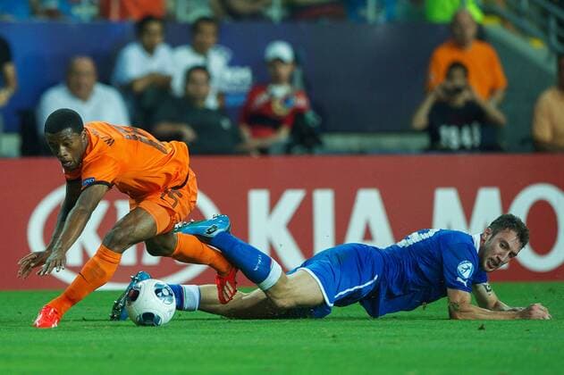 (L-R) Georginio Wijnaldum of Holland U21, Vasco Regini of Italy U21 during the UEFA EURO U21 championship semi-final match between Italy and Netherlands on June 15, 2013 at the HaMoshava stadium at Petach Tikva, Israel. Italy U21 v Holland U21 UEFA EURO U21 2012 2013 xVIxxIVx 1608385