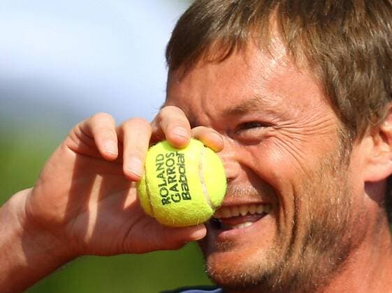 ITAR-TASS: MOSCOW, RUSSIA. JUNE 16, 2013. Russia s tennis player Alexander Volkov at Tennis Legends Moscow 2013.  RE11ED5C