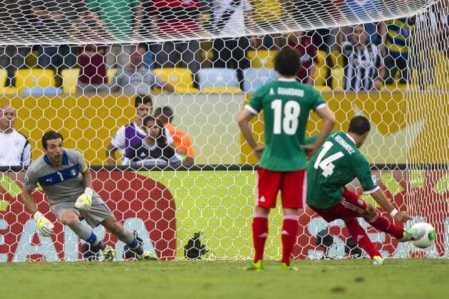 (130616) -- RIO DE JANEIRO, June 16, 2013 (Xinhua) -- Mexico s Javier Hernandez (Chicharito) (R) scores under the gaze of Gianluigi Buffon (L) of Italy, during the FIFA s Confederations Cup Brazil 2013 match, held at Maracana Stadium, in Rio de Janeiro, Brazil, on June 16, 2013. Italy won 2-1. (Xinhua StraffonImages) (itm) (SP)BRAZIL-RIO DE JANEIRO-CONFEDERATIONS-MEXICO VS ITALY 