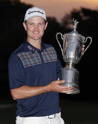 Justin Rose holds the USA Open Championship Trophy at the 113th U.S. Open at Merion Golf Club in Ardmore, Pennsylvania on June 16, 2013.  PHI20130616125