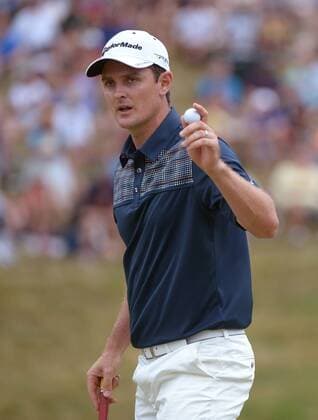 Justin Rose acknowledges the gallery after making a putt for par on the 9th green during the fourth round 113th U.S. Open Championship at Merion Golf Club in Ardmore, Pennsylvania on June 16, 2013.  PHI20130616306