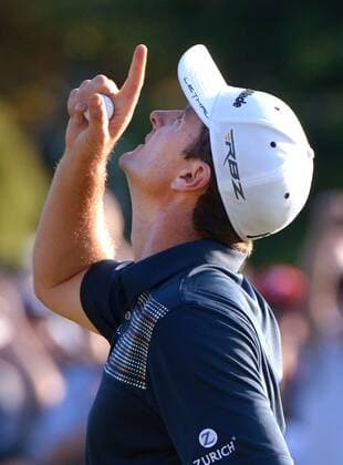 Justin Rose points to the sky after winning the 113th U.S. Open Championship at Merion Golf Club in Ardmore, Pennsylvania on June 16, 2013. Rose won with a four day total of one-over-par with a 281.  PHI20130616328