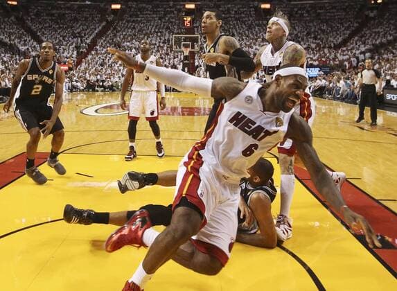 June 18, 2013 - Miami, FL, USA - The Miami Heat s LeBron James (6) spins out after his layup was denied by the San Antonio Spurs Tim Duncan, who is on the floor behind James, in the second quarter in Game 6 of the NBA Basketball Herren USA Finals on Tuesday, June 18, 2013, at the AmericanAirlines Arena in Miami, Florida. Game 6 - NBA Basketball Herren USA Finals - ZUMAm67