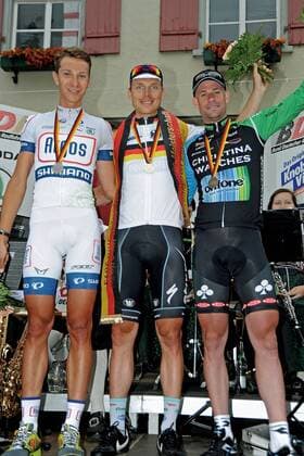 Podium v.l.n.r. (2.) Patrick GRETSCH ( GER Argos - Shimano ) - (1.) Tony MARTIN ( GER Omega Pharma - Quick Step ) - (3.) Stefan SCHUMACHER ( GER Christina Watches - Onfon ) - Siegerehrung - Medaillen - Jubel - Freude - Emotionen - hoch - Event: Deutsche Meisterschaften 2013 - Einzelzeitfahren - I.T.T. - Zeitfahren - Contre la Montre - Individual Time Trial - Location: Deutschland - Wangen - Bayern - Europa - Datum: 21.06.2013