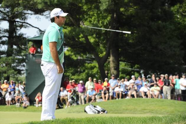 June 22, 2013 - Cromwell, Connecticut, USA - Jun 22, 2013 - Cromwell, Connecticut, U.S. - Patrick Reed flips his club in the air after being unhappy with his chip shot to the 9th green during the third round of the PGA Golf Herren Travelers Championship held at TPC River Highland in Cromwell Connecticut. Reed parred the hole and finished the day tied for 19th place with a score of 73. Eric Canha CSM PGA Golf Herren 2013: Travelers Championship JUN 22 - ZUMAc04
