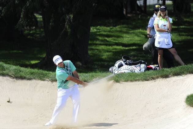 June 22, 2013 - Cromwell, Connecticut, USA - Jun 22, 2013 - Cromwell, Connecticut, U.S. - Patrick Reed works his way out of a trap on the 8th hole while being watched by wife and caddy Justine Reed during the third round of the PGA Golf Herren Travelers Championship held at TPC River Highland in Cromwell Connecticut Eric Canha CSM PGA Golf Herren 2013: Travelers Championship JUN 22 - ZUMAc04