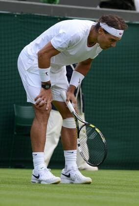 Tennis - 2013 Wimbledon Championships - Men s Singles First Round on Court 1. Rafael Nadal (Spain) on his way to defeat 