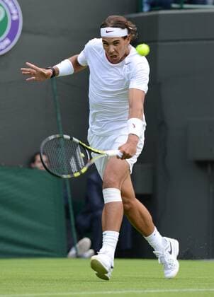 Tennis - 2013 Wimbledon Championships - Men s Singles First Round on Court 1. Rafael Nadal (Spain) on his way to defeat 