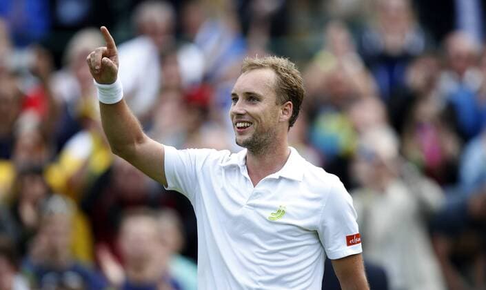 Steve Darcis of Belgium celebrates after the first round of the men s singles at the Wimbledon Lawn Tennis Championships in the All England Lawn Tennis and Croquet Club in London, Britain, on June 24, 2013. (Xinhua Wang Lili) (SP)BRITAIN-LONDON-TENNIS-WIMBLEDON 